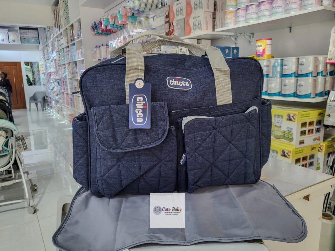 Navy Chicco diaper bag with its grey changing mat